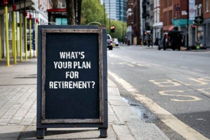 The words "what's your plan for retirement" written on chalkboard on pavement somewhere in London