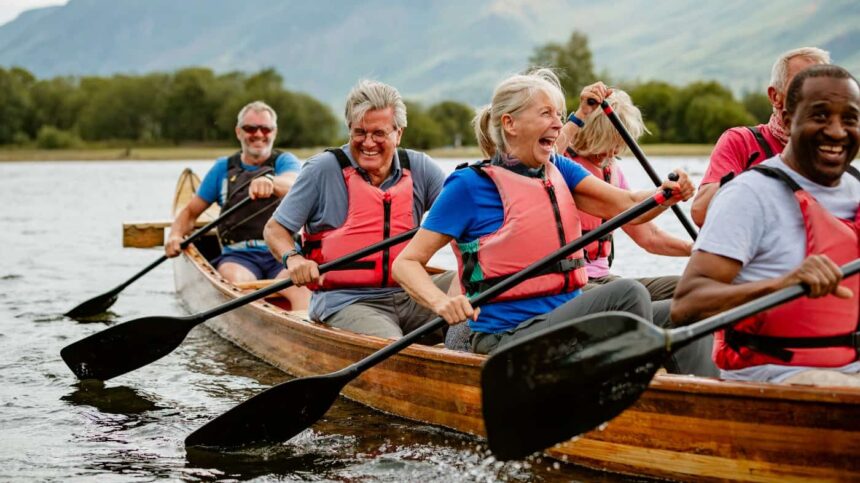 A senior group of friends enjoying rowing on the River Derwent