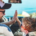 Road trip. Father and son travelling together by car