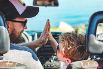 Road trip. Father and son travelling together by car